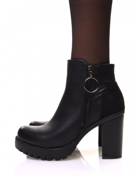 Black heeled ankle boots with decorative zipper