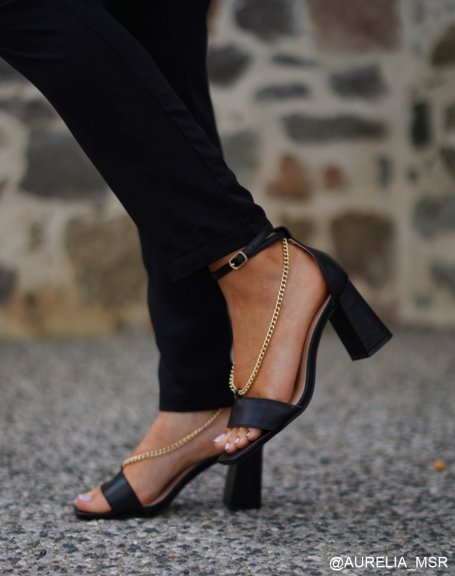 Black heeled sandals with dropped chains