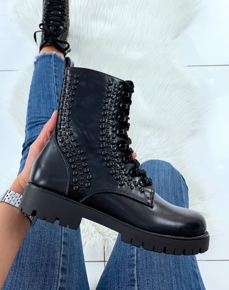 Black high ankle boots adorned with black pearls