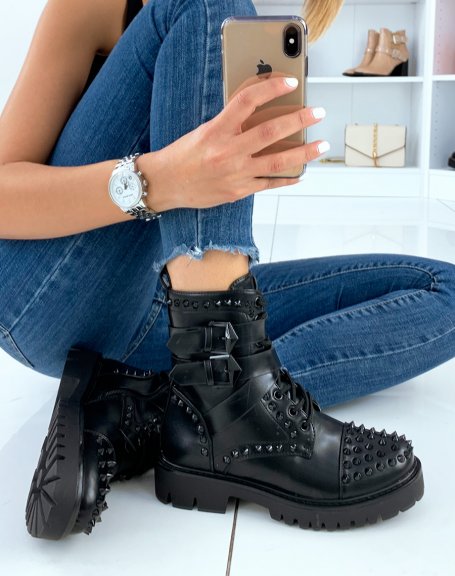 Black high ankle boots adorned with black studs