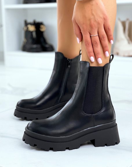 Black high heel Chelsea boots with notched sole