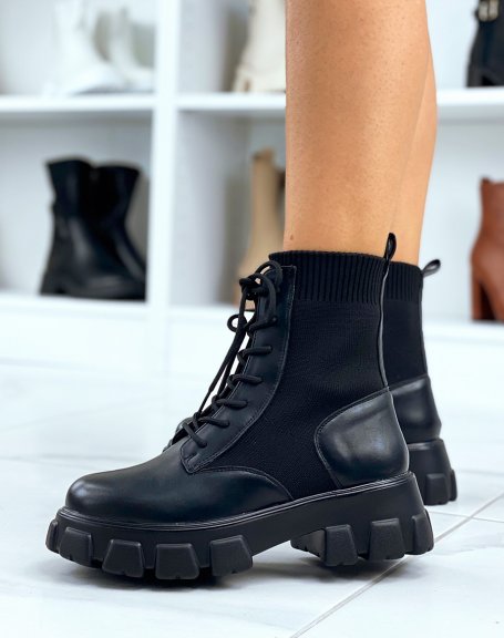 Black high sock-effect ankle boots with notched soles