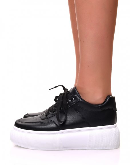 Black lace-up sneakers with white high platforms