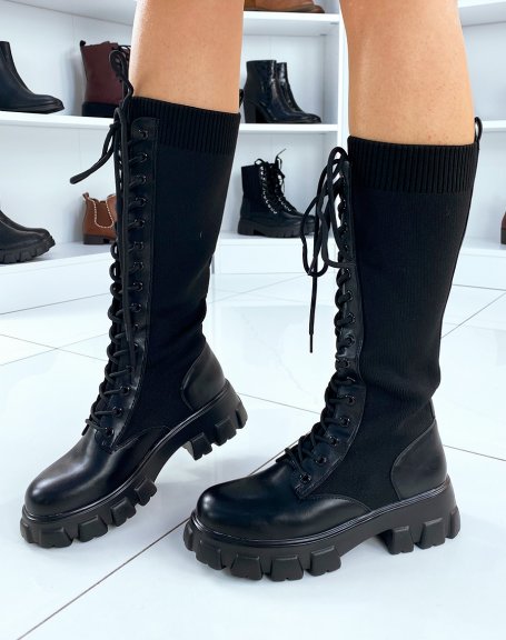 Black lace-up sock-style boots with lug soles