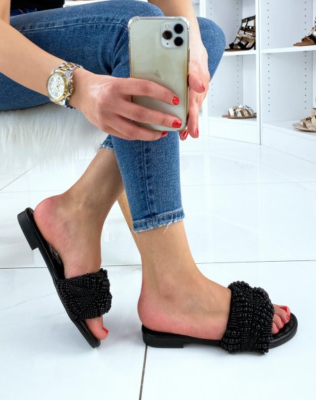 Black mules adorned with black pearls
