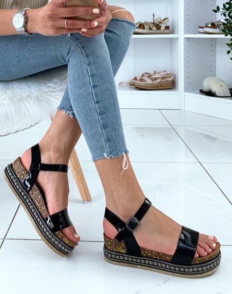 Black patent strap sandals and studded platforms