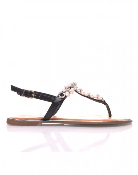 Black sandals decorated with pearls