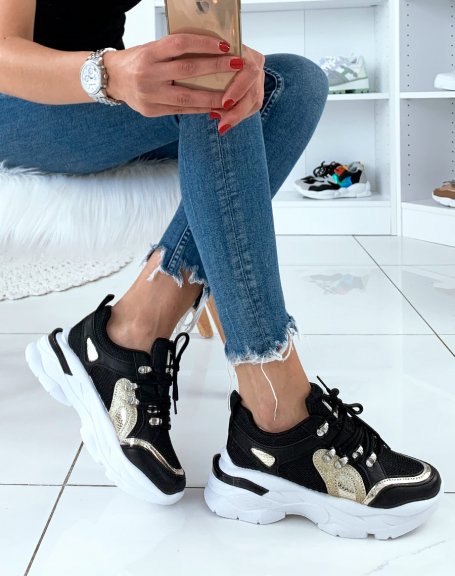 Black sneakers with gold insert and band on heel