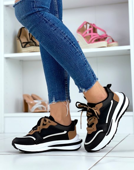 Black sneakers with multiple brown and white inserts with large sole