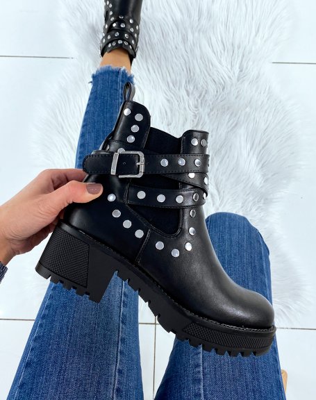 Black studded ankle boots with notched soles