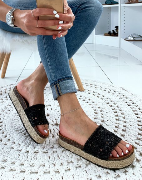 Black wicker mules with braided patterns and platform