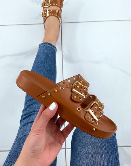 Brown flat mules with adjustable straps and gold studs