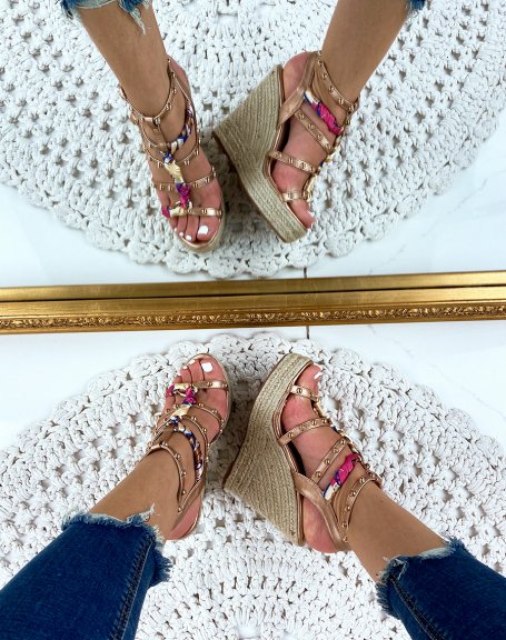 Champagne-colored studded wedges
