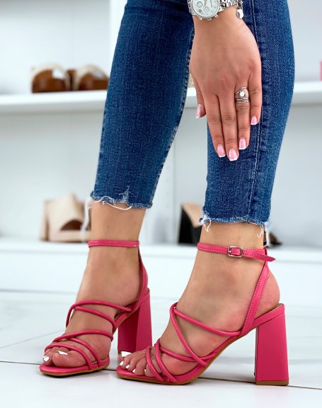 Fushia sandals with criss-cross straps and thick heel