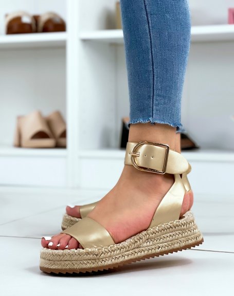 Golden sandals with thick straps and hessian sole