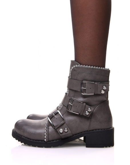 Gray ankle boots with straps and studded details