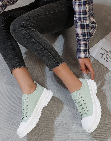 Green sneakers with notched sole