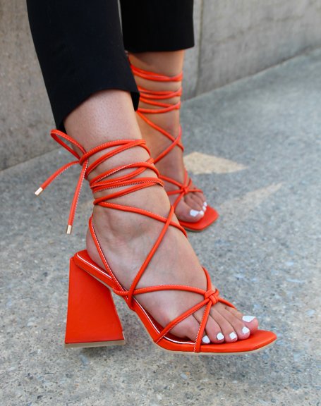 Orange sandals with laces and triangular heel