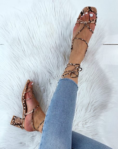 Snake sandals with low heel and multiple straps