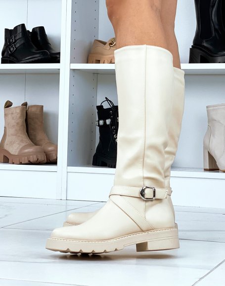 Tall beige boots with crossed straps