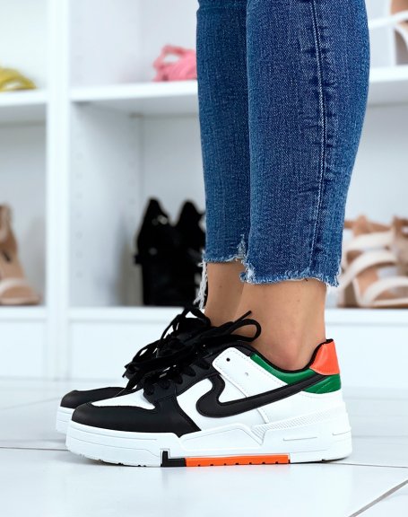 White and black sneakers with orange and green details