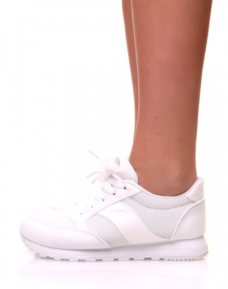 White canvas sneakers with laces and white sole