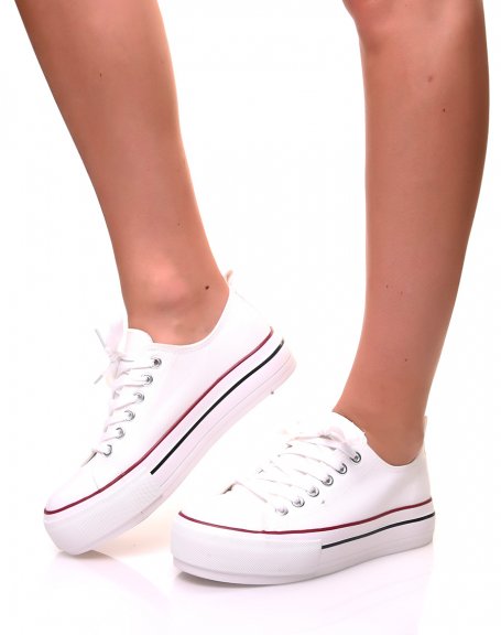 White canvas sneakers with platforms decorated with trims