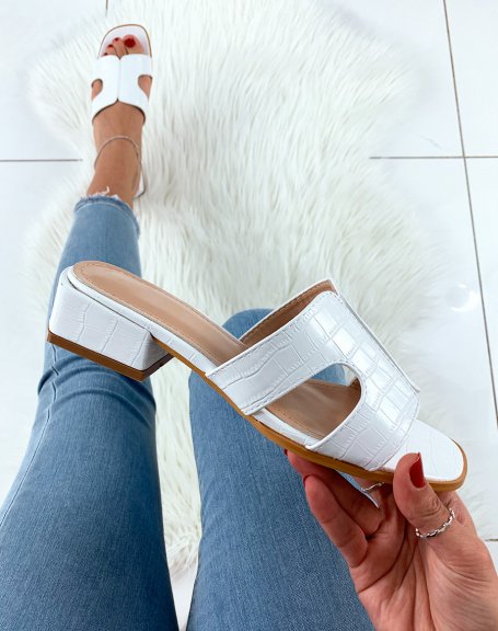 White croc-effect mules with wide straps and low heels