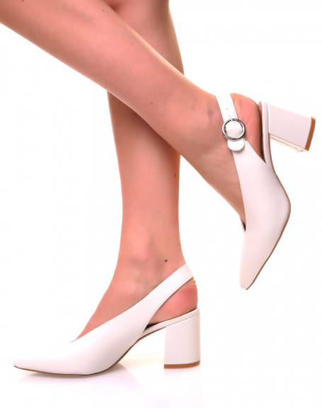 White pumps with small heels open at the back