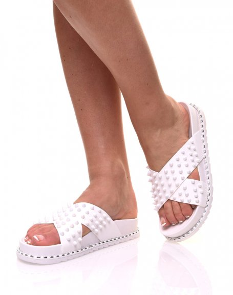 White sandals with crossed studs