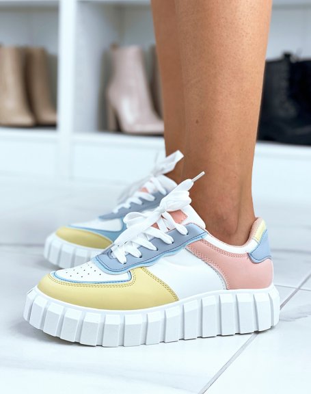 White sneakers with blue, yellow and pink inserts and chunky sole