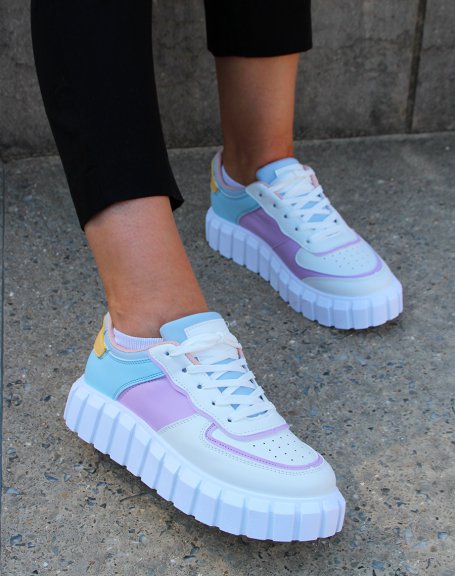 White sneakers with blue, yellow, pink and purple inserts with chunky sole