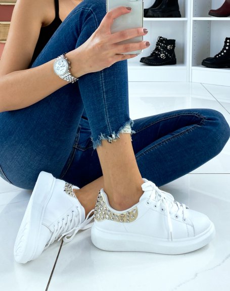 White sneakers with gold insert and studs