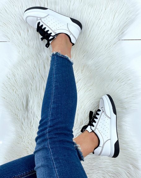 White sneakers with laces and black stitching