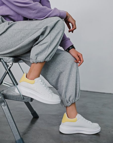 White sneakers with pastel yellow insert