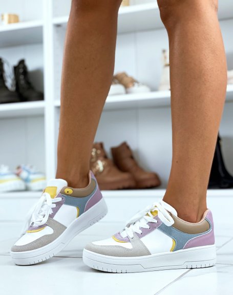 White sneakers with pink, yellow, purple, blue and gray panels