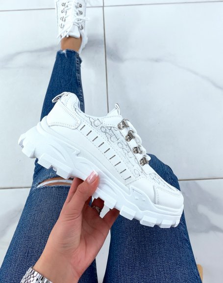 White sneakers with silver detail and notched sole