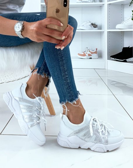 White sneakers with silver inserts and fancy laces