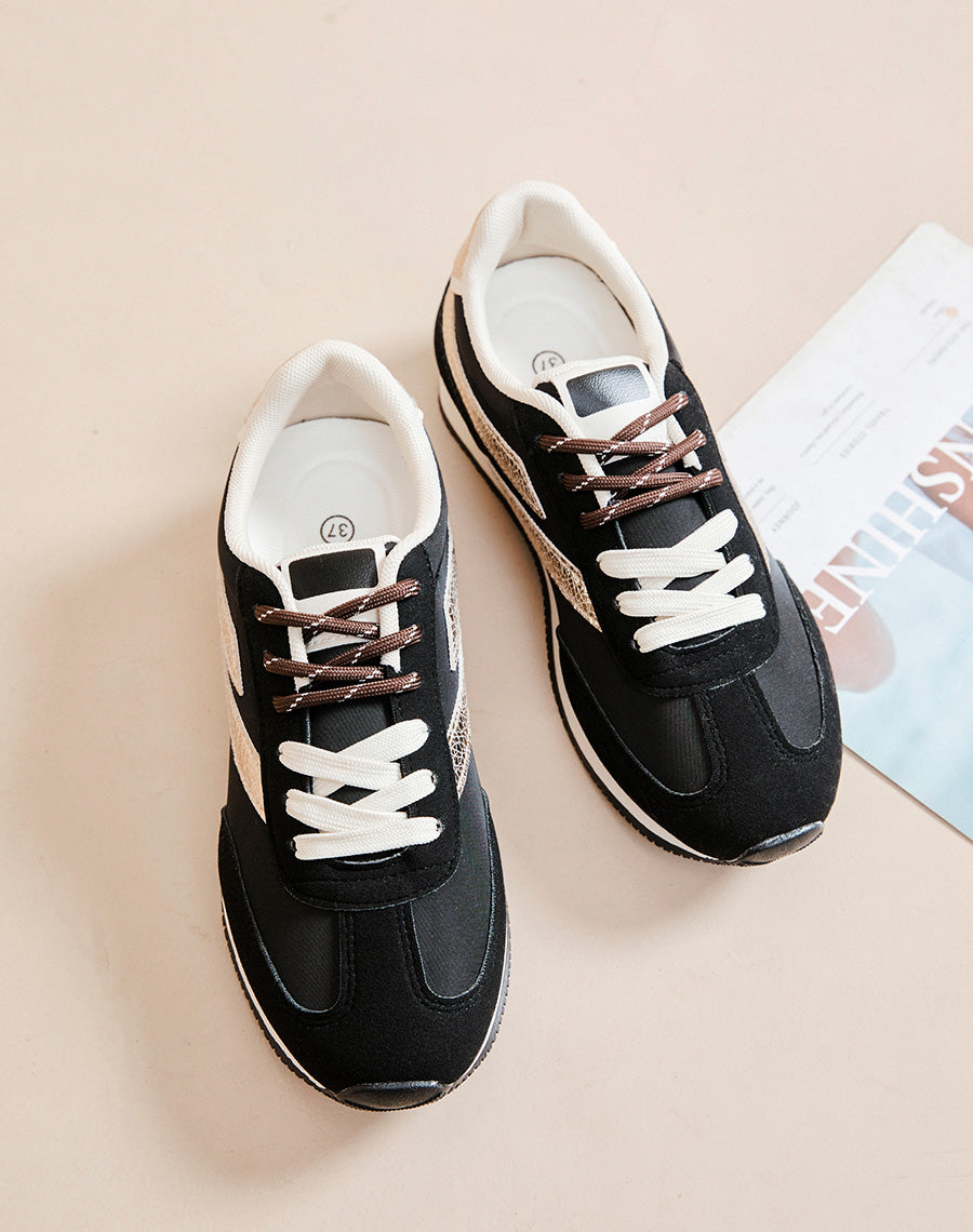 Baskets femme noires avec empiècements dorés effet croco et double lacets