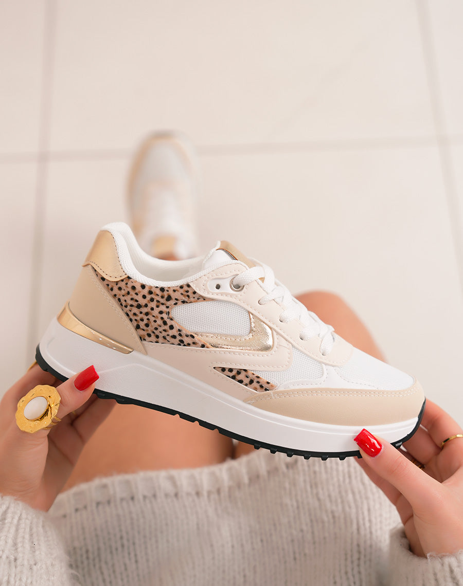 Trendy beige women's sneakers with golden touches and black notch sole