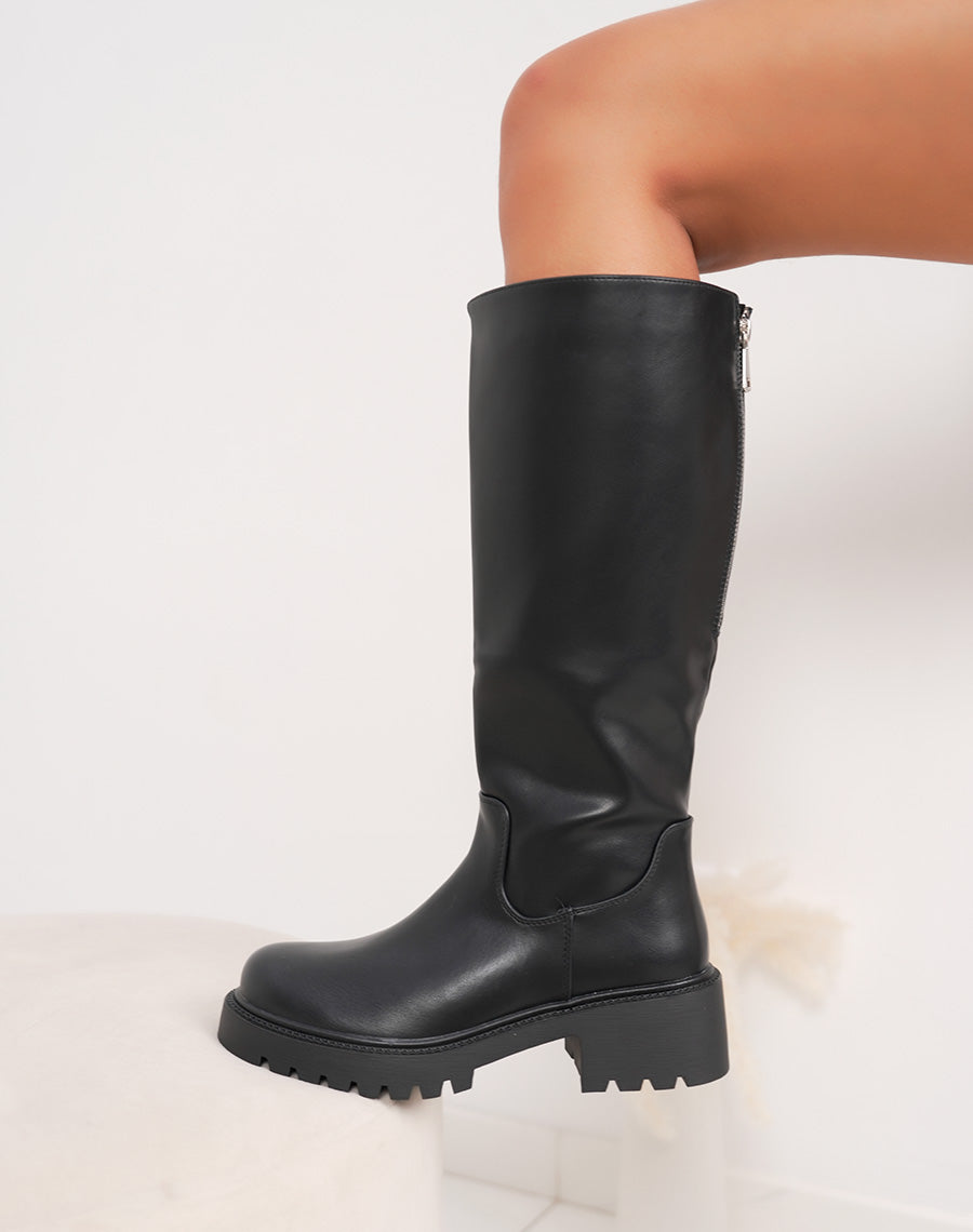 Bottes noires à semelle crantée et zip argenté
