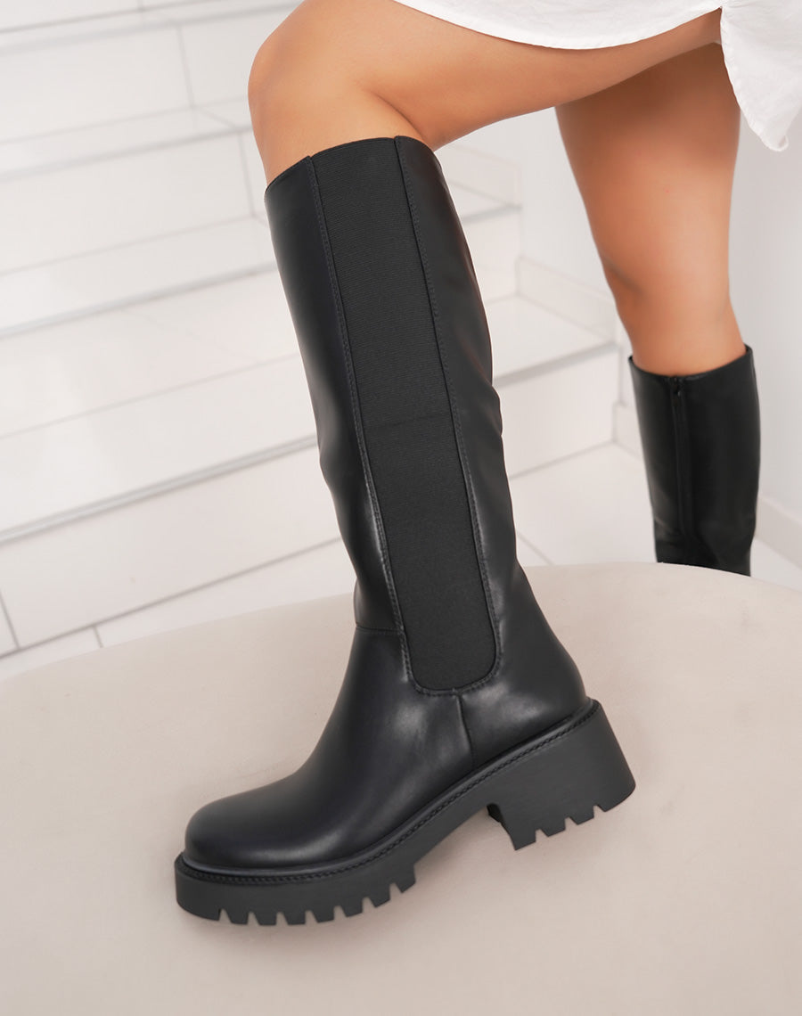 Bottes noires à semelle crantée et élastique latéral
