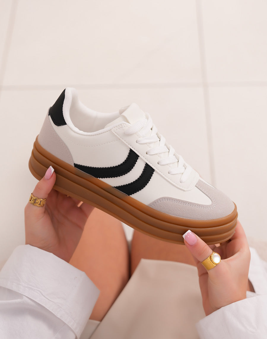White women's sneakers with black stripes and triple brown platform