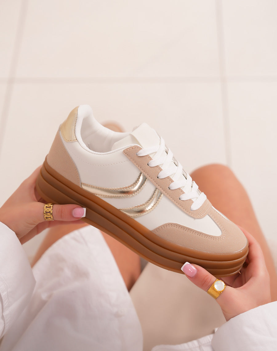 White women's sneakers with golden stripes and triple brown platform
