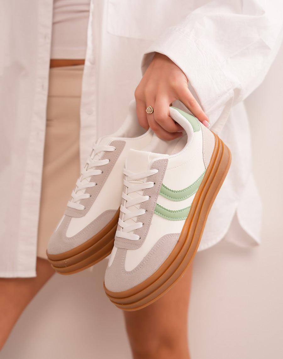 White women's sneakers with green stripes and triple brown platform
