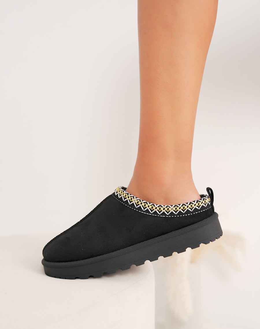 Mules femme noires élégantes en suédine avec liseré rayé et intérieur fourré