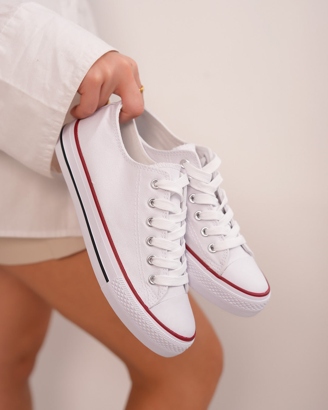 White sneakers with red border