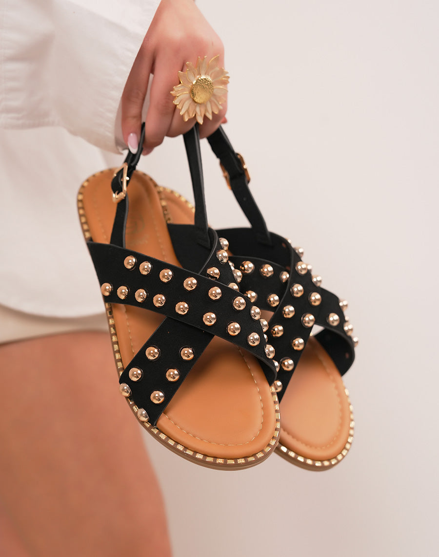 Sandales femme noires plates à brides croisées en suédine et clous dorés