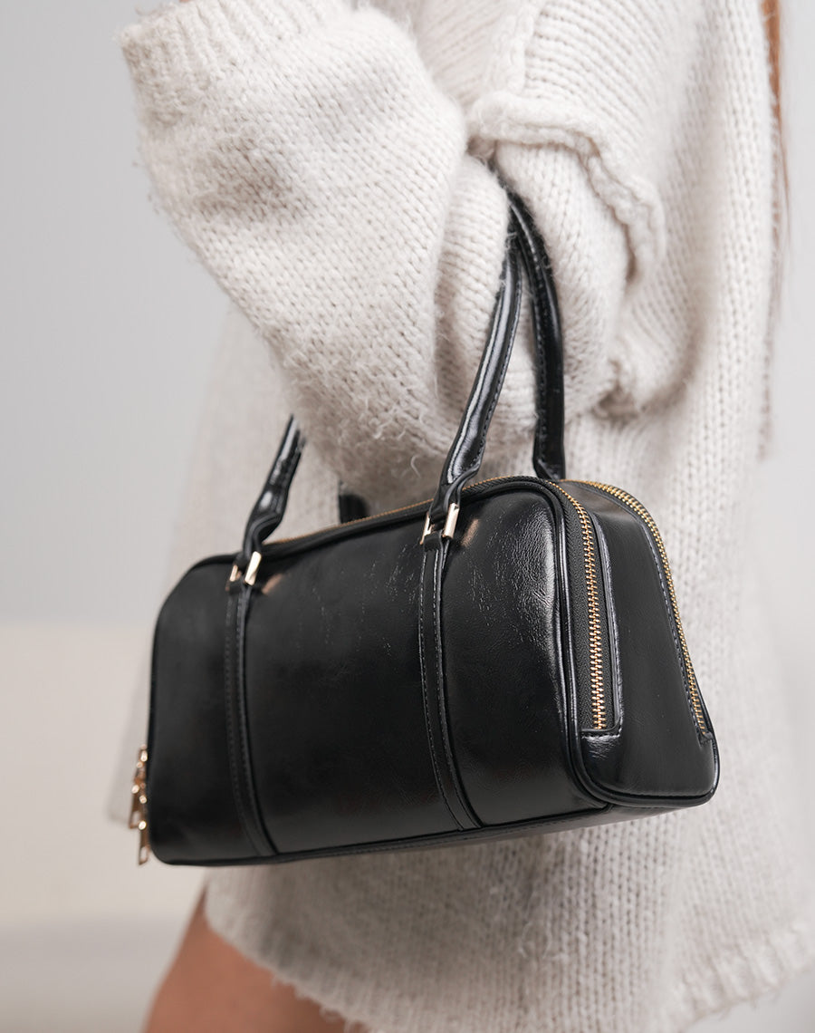 Sac noir brillant à double fermeture dorée