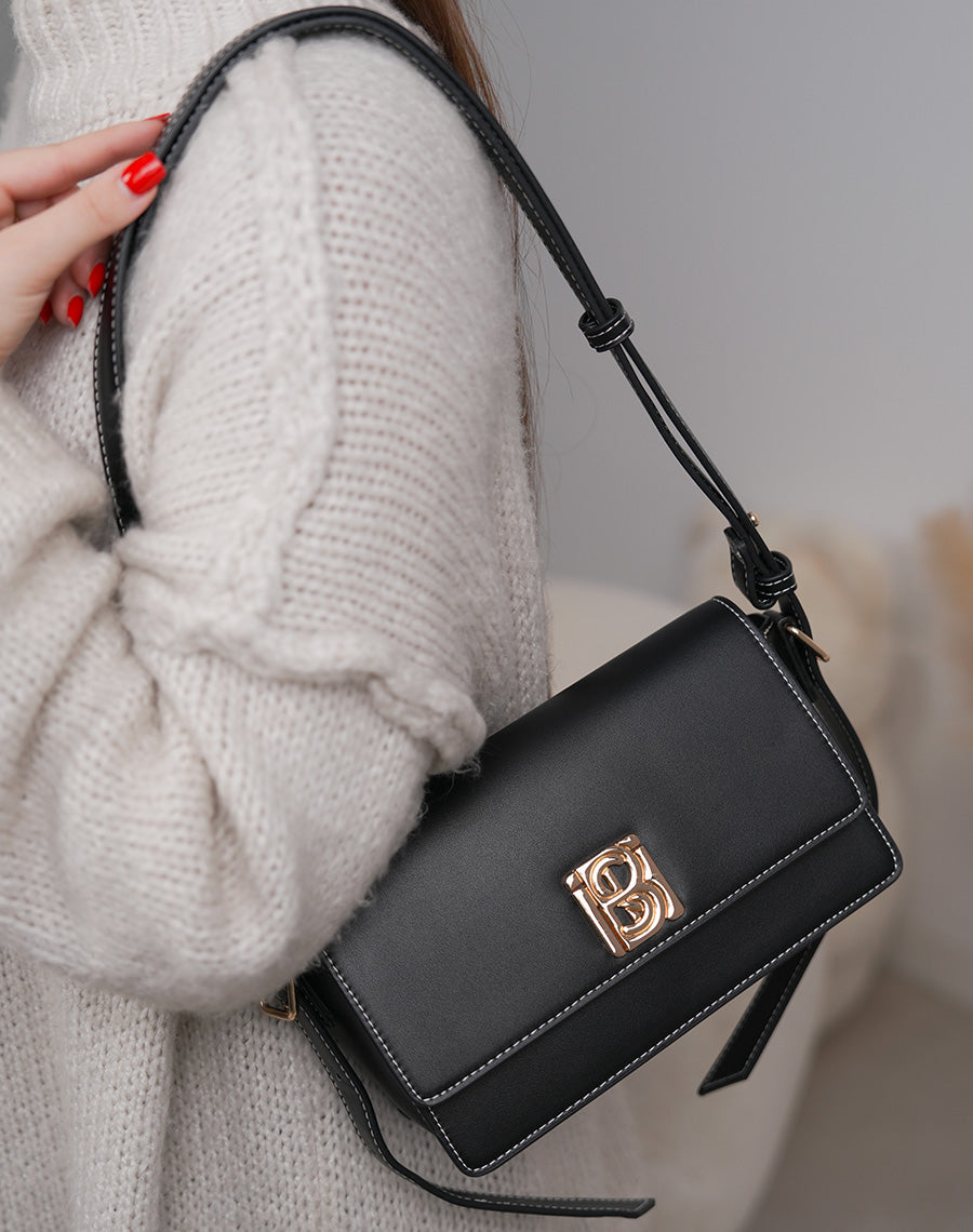 Sac noir à détail doré avec fermeture aimantée